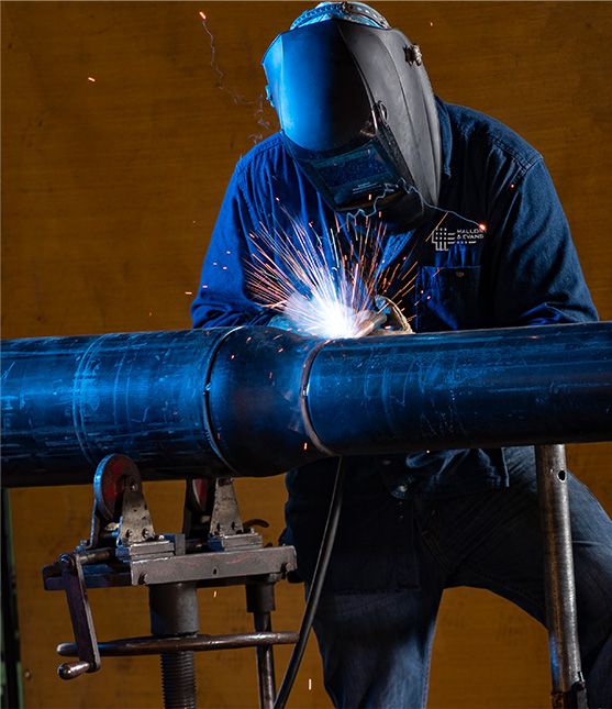 a worker welding a pipe