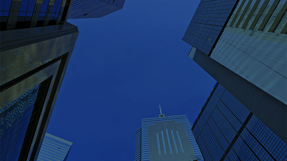 looking up between several skyscrapers