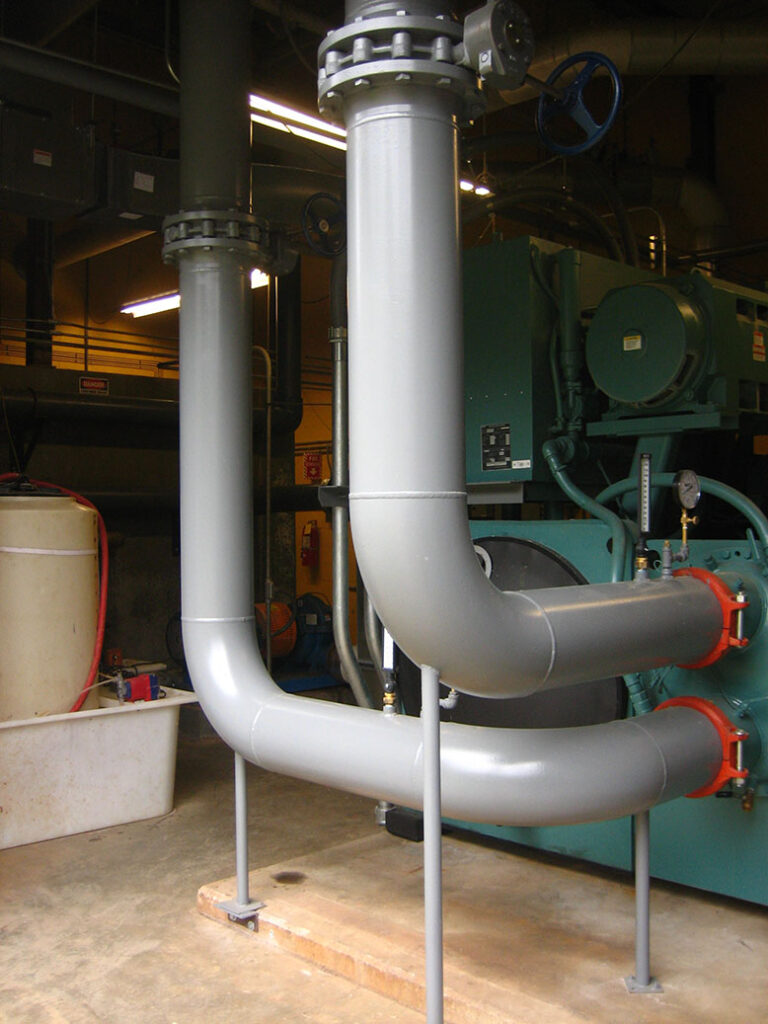 gray pipes going into a chiller