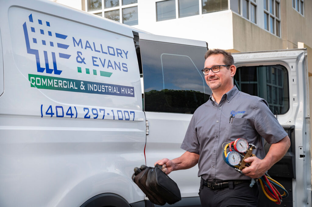 A service technician leaving his van