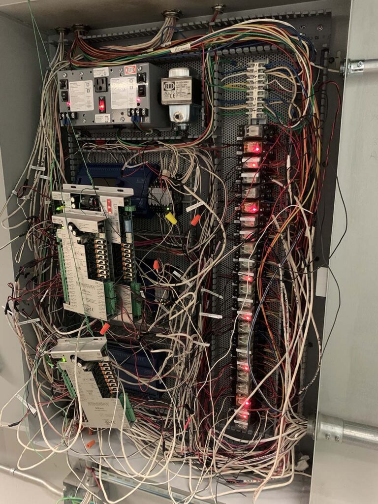 a control box with wires going in every direction